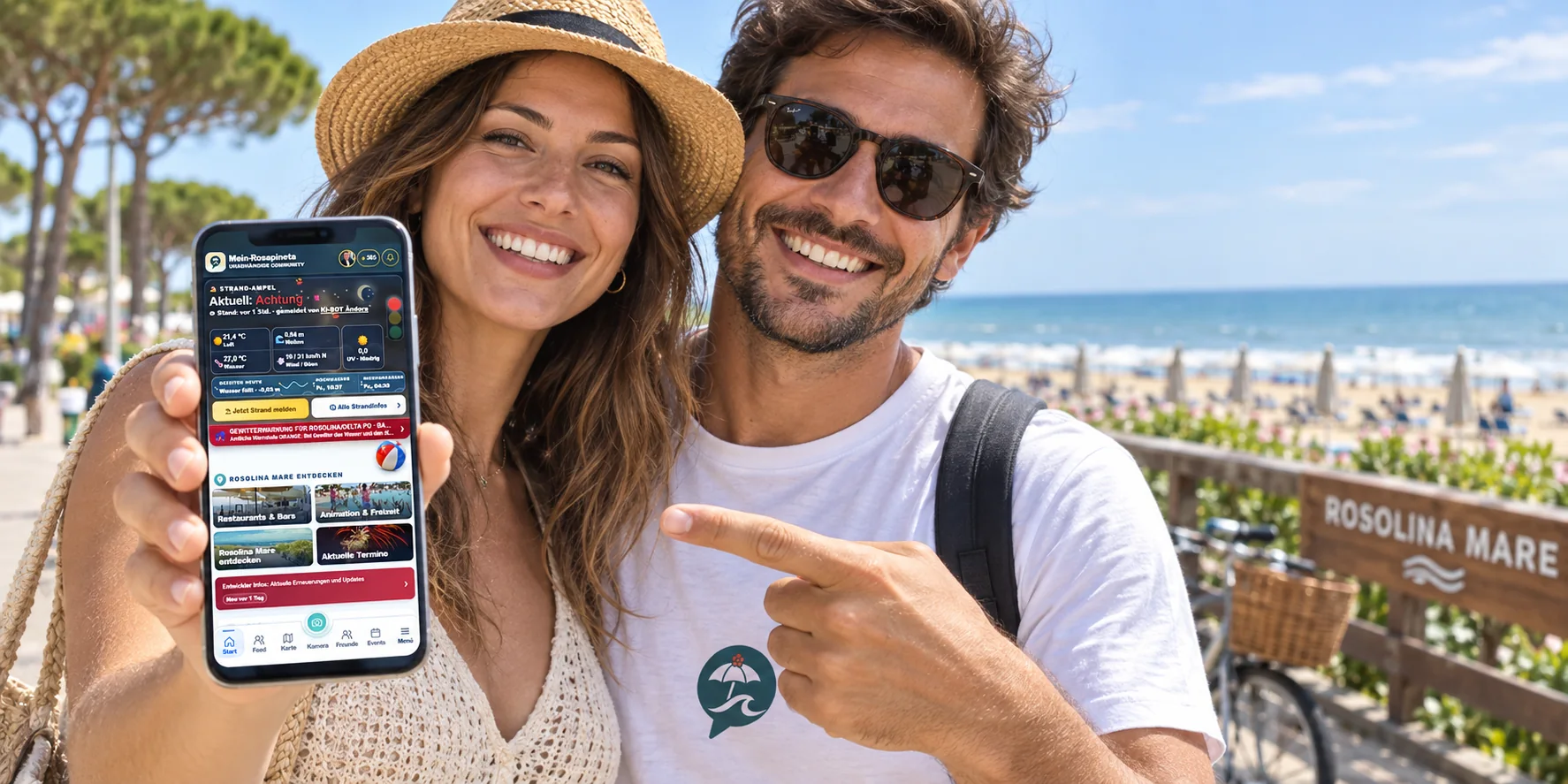 Zwei Rosolina-Mare-Gäste zeigen die Mein-Rosapineta-App auf einem Smartphone